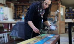 Genç ressam şehri renklendiriyor